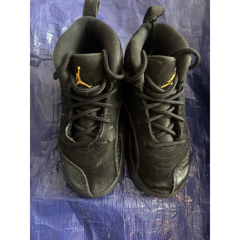 Air Jordan 12 Retro "Black Taxi" sneakers in a toddler size Good Condition